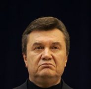 Ukrainian PM and Moscow-backed presidential candidate Yanukovich listens to questions during news …