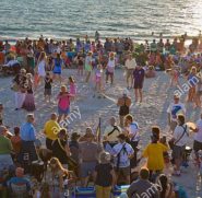 drum-circle-gathering-on-casey-key-public-beach-on-the-gulf-of-mexico-C2N1TW